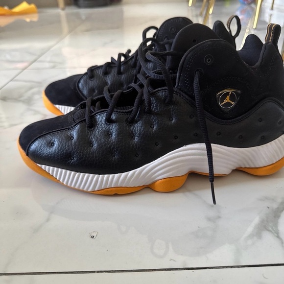 black and yellow team jordans
